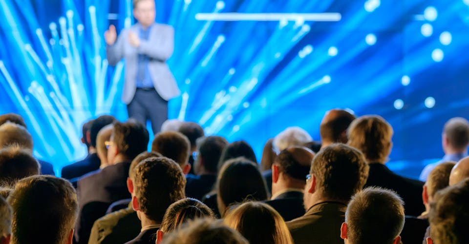 corporate event master of ceremonies making a speech